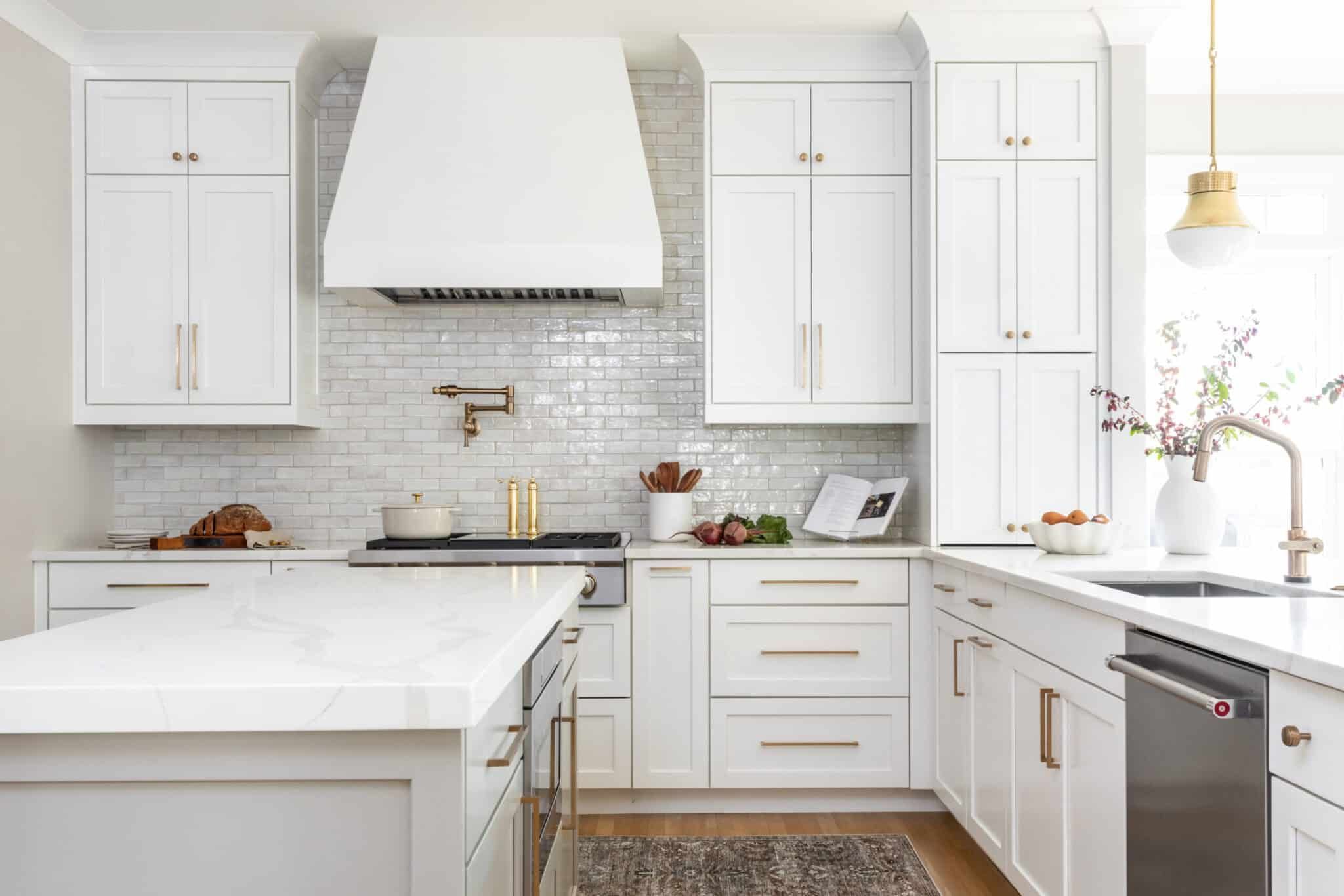 Project Hampton white kitchen with brass and gold fixtures.
